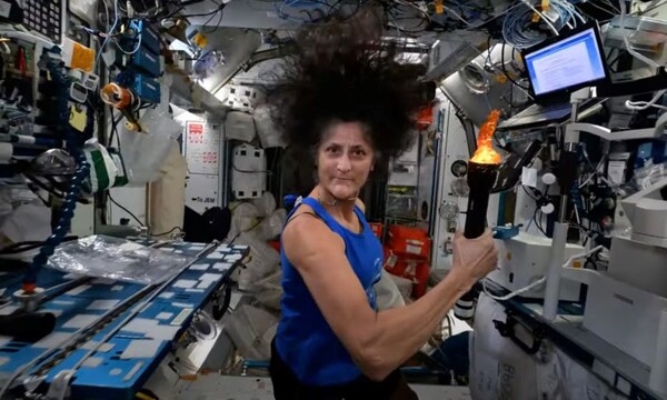 Sunita Williams holding Olympic Torch in ISS